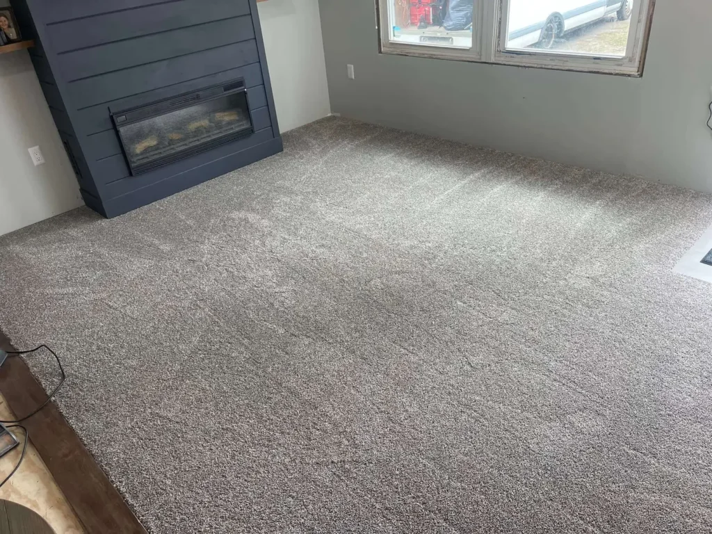 Cozy bedroom with soft grey plush carpet installed by Master Carpet, enhancing comfort and style in London, Ontario homes