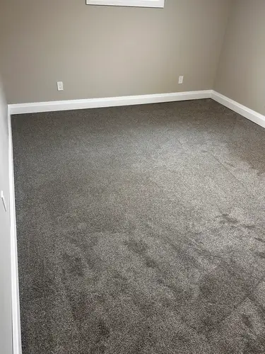 New basement carpet installation in Old East Village, London, Ontario after professional installation, warm and finished look