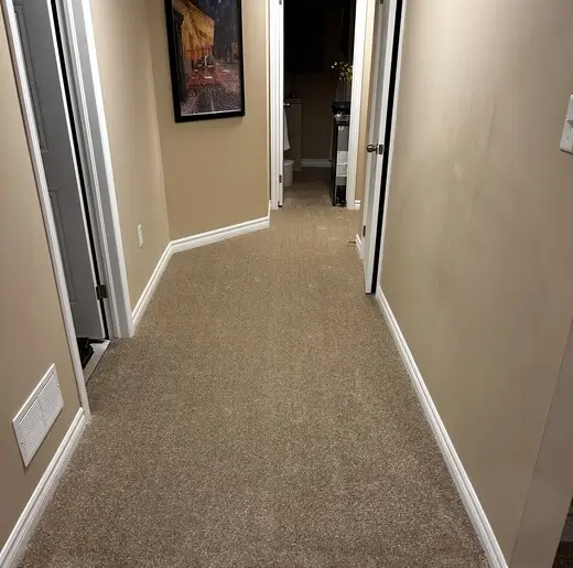New carpet installation in basement hallway in Pond Mills, London, Ontario after professional installation, warm and finished look
