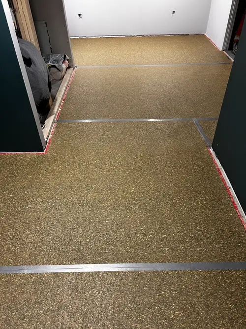 Basement with new carpet underpad in Masonville, London Ontario before grey plush carpet installation