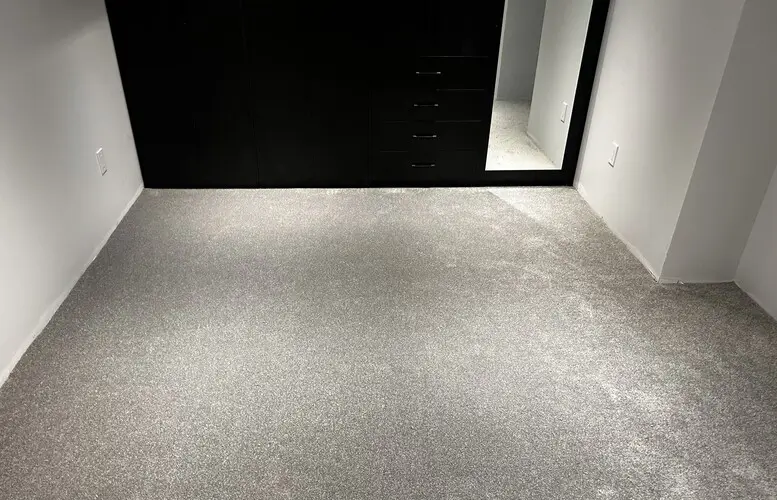 New bedroom carpet installation in London, Ontario after professional installation, cozy and finished look