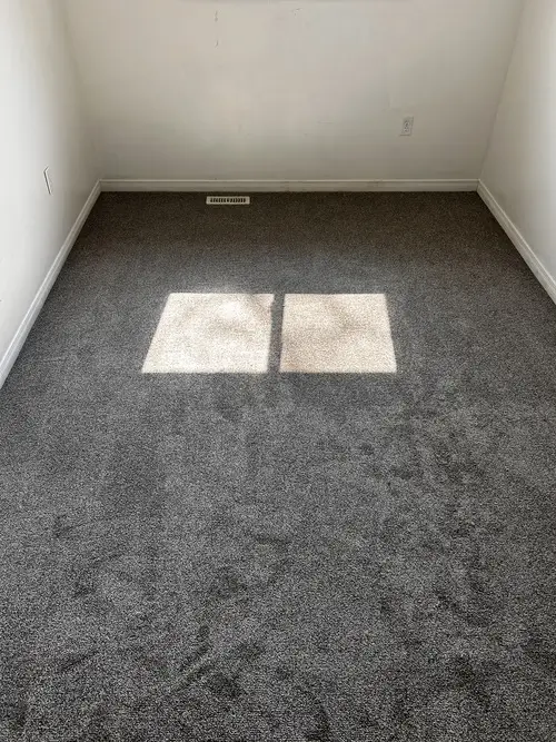 New bedroom carpet installation in Westmount, London, Ontario after professional installation, cozy and finished look