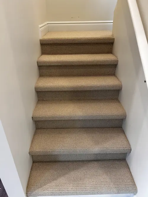Beige Berber carpet installed on staircase in Old East Village, London, Ontario after professional installation