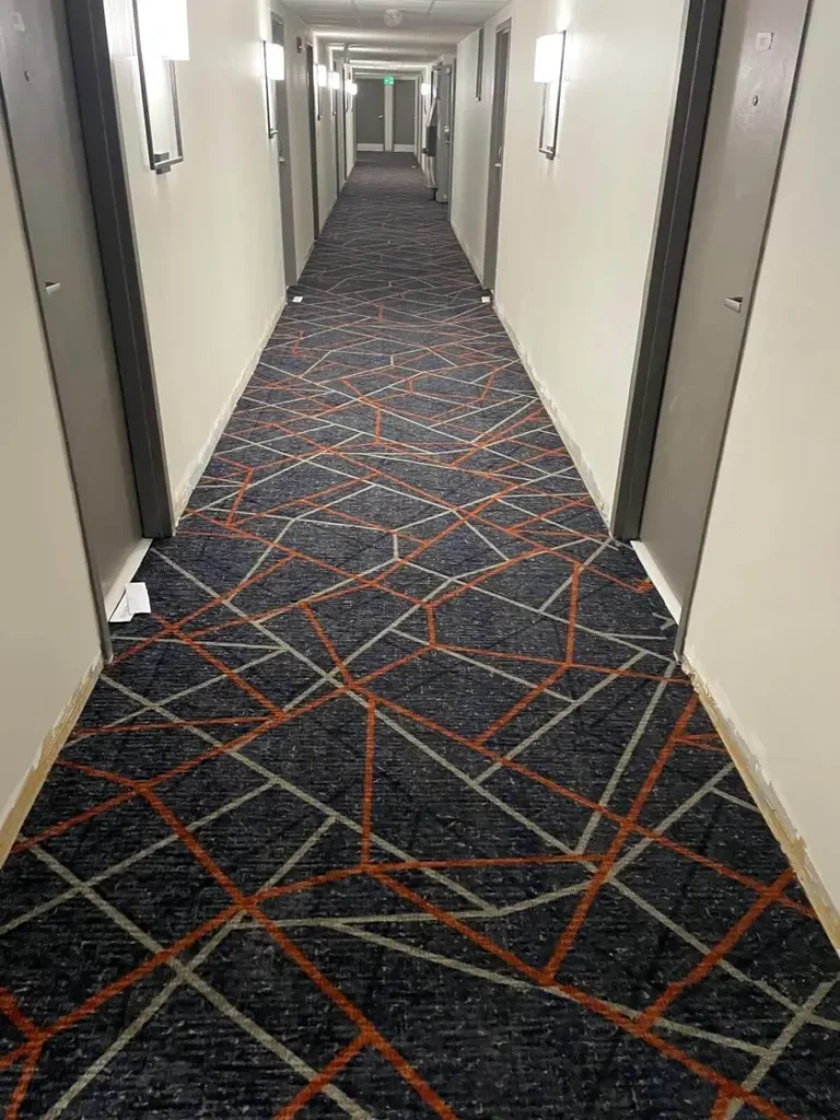 Patterned commercial carpet installed by Master Carpet in the hallway of Holiday Inn