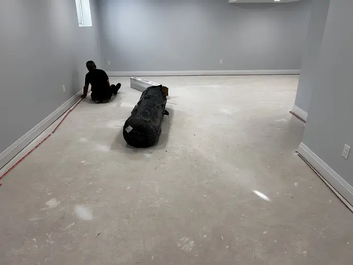 Concrete basement floor in Masonville, London, Ontario before carpet installation, ready for flooring upgrade