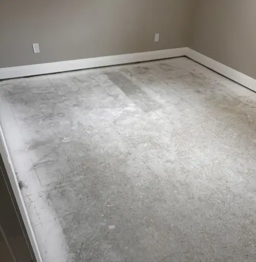 Concrete basement floor in Old East Village, London, Ontario before carpet installation, ready for flooring upgrade