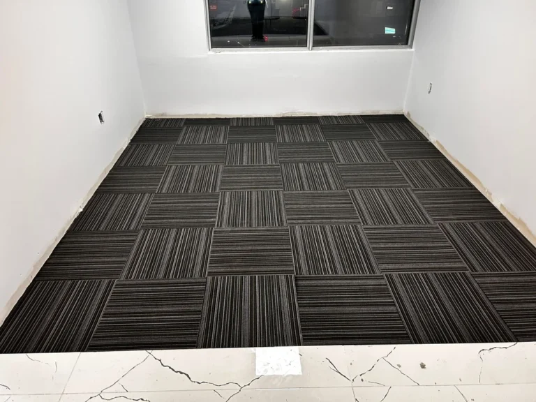 Office room with black commercial carpet tile, line design, quarter-turn install in Downtown London ON