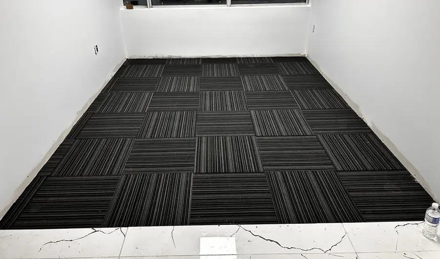 linear design commercial carpet tiles installed in office in Downtown London Ontario after professional installation