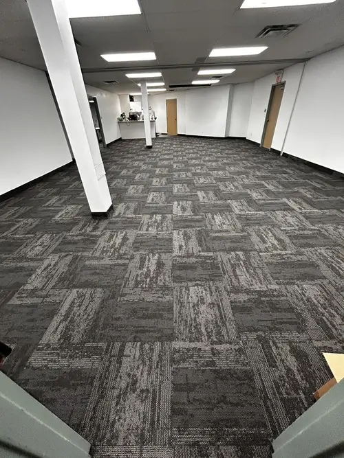 Dark grey design commercial carpet tile installed in conference room, London downtown office