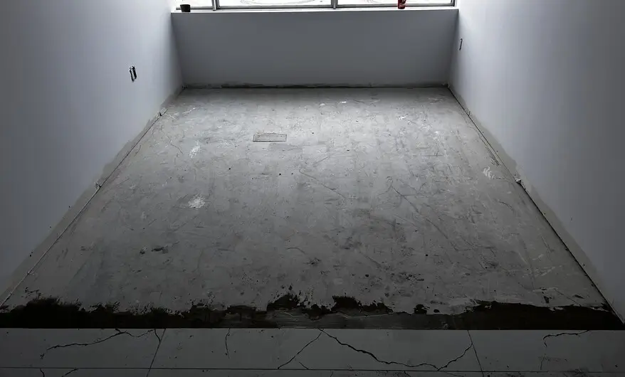 office with bare concrete floor in Downtown London Ontario before commercial carpet tile installation