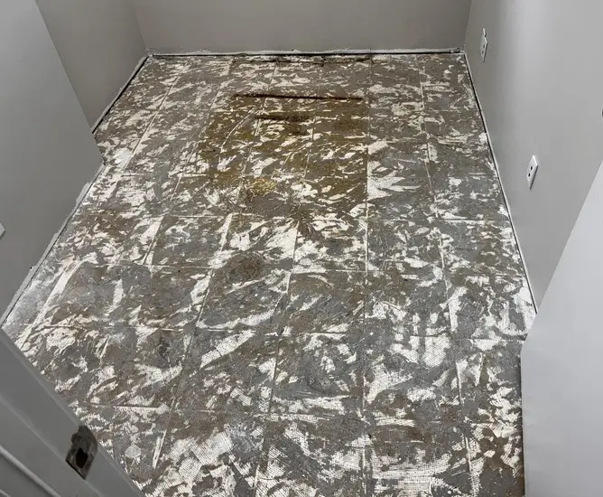 office with bare concrete floor in South London Ontario before commercial carpet tile installation