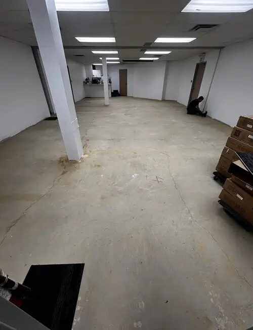 Office bare concrete floor before modern carpet tile installation in downtown London, Ontario – commercial flooring renovation project