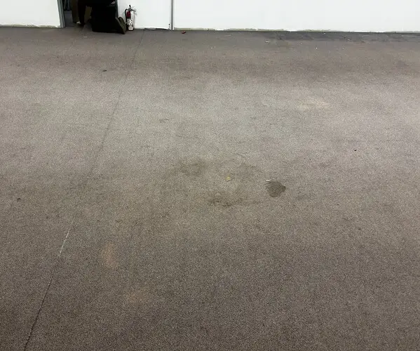 Office with old carpet in downtown London, Ontario before modern carpet tile installation