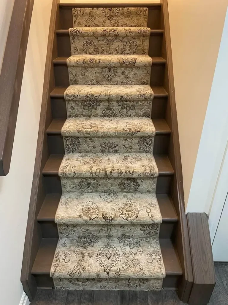 Persian style carpet stair runner installed on residential stairs in London Ontario, elegant and durable flooring
