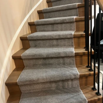 Grey pattern carpet runner installed on hardwood stairs โ stylish and durable stair runner in London Ontario home