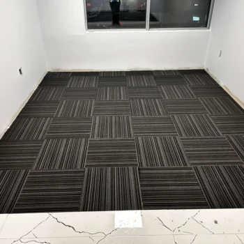 Office room with black commercial carpet tile, line design, quarter-turn install in Downtown London ON