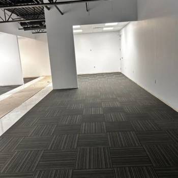 Conference room with black commercial carpet tile, line pattern, quarter-turn install in Downtown London ON