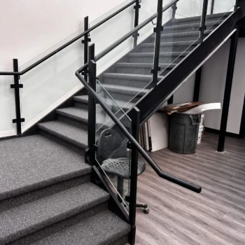 Uplink commercial carpet installed on concrete stairs in London Ontario, durable and slip-resistant stair carpet.