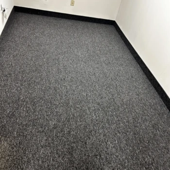 Charcoal commercial carpet installed wall-to-wall in office room in London Ontario, durable and modern flooring
