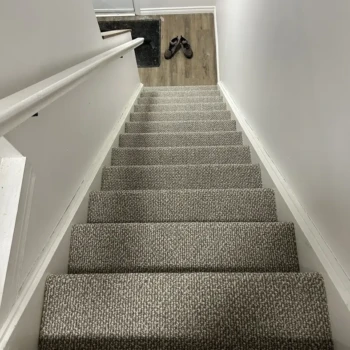 Interstellar Berber carpet professionally installed on stair treads in a London Ontario home by Master Carpet