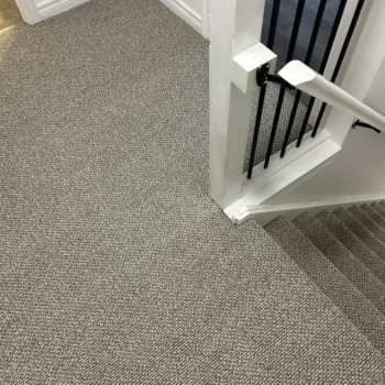 Interstellar Berber Pebble Hill carpet covering stair treads and landing in London Ontario by Master Carpet