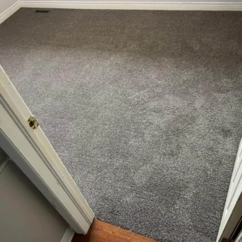 Bedroom carpet installation in London, Ontario featuring Serenity Pathway — a modern taupe plush carpet.
